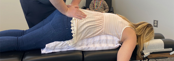 Chiropractor Grand Rapids MI Joseph House Adjusting Pregnant Patient