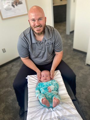 Chiropractor Grand Rapids MI Joseph House With Infant